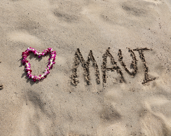 Love Maui written on beach